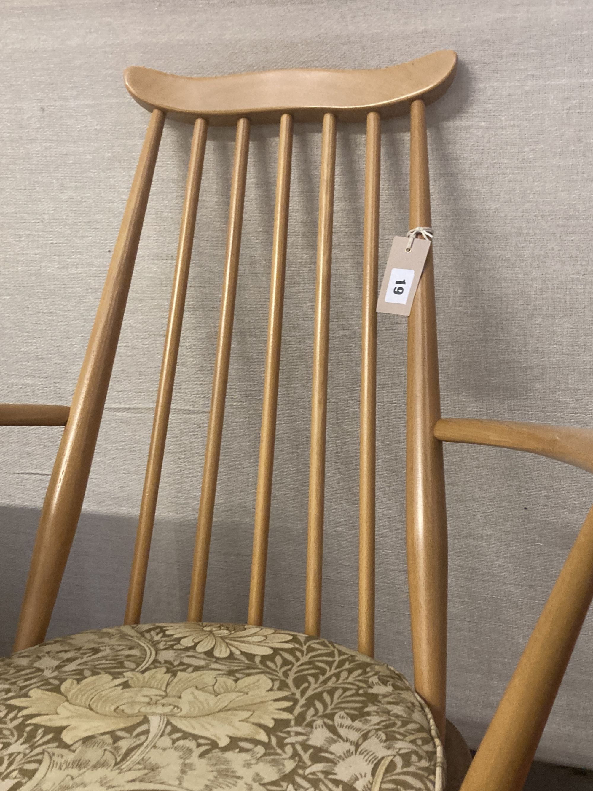 An Ercol stickback beech rocking chair